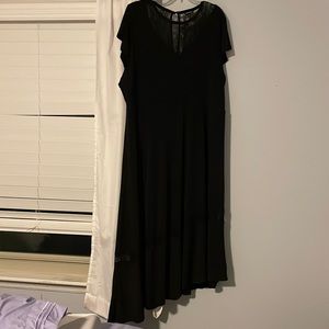 Torrid black dress size 4 (24/26) with asymmetrical hem and lace details.